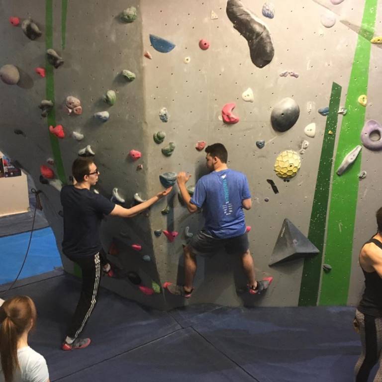 Two men climbing a couples climb