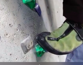 Climbers' foot on a small hold