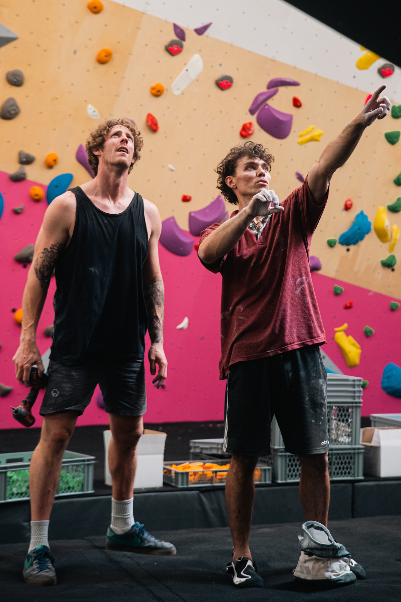 Drew and Jake discuss a boulder during testing